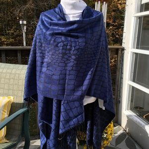 Blue and black animal print wrap with fringed edges. Can be worn many ways.